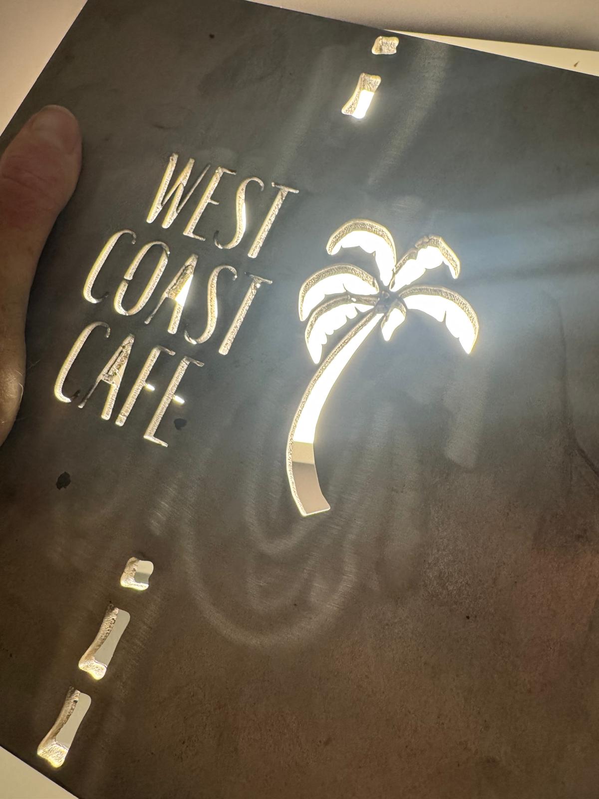 Backlit laser-cut steel sign